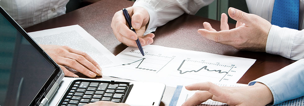 Business meeting reviewing financial data